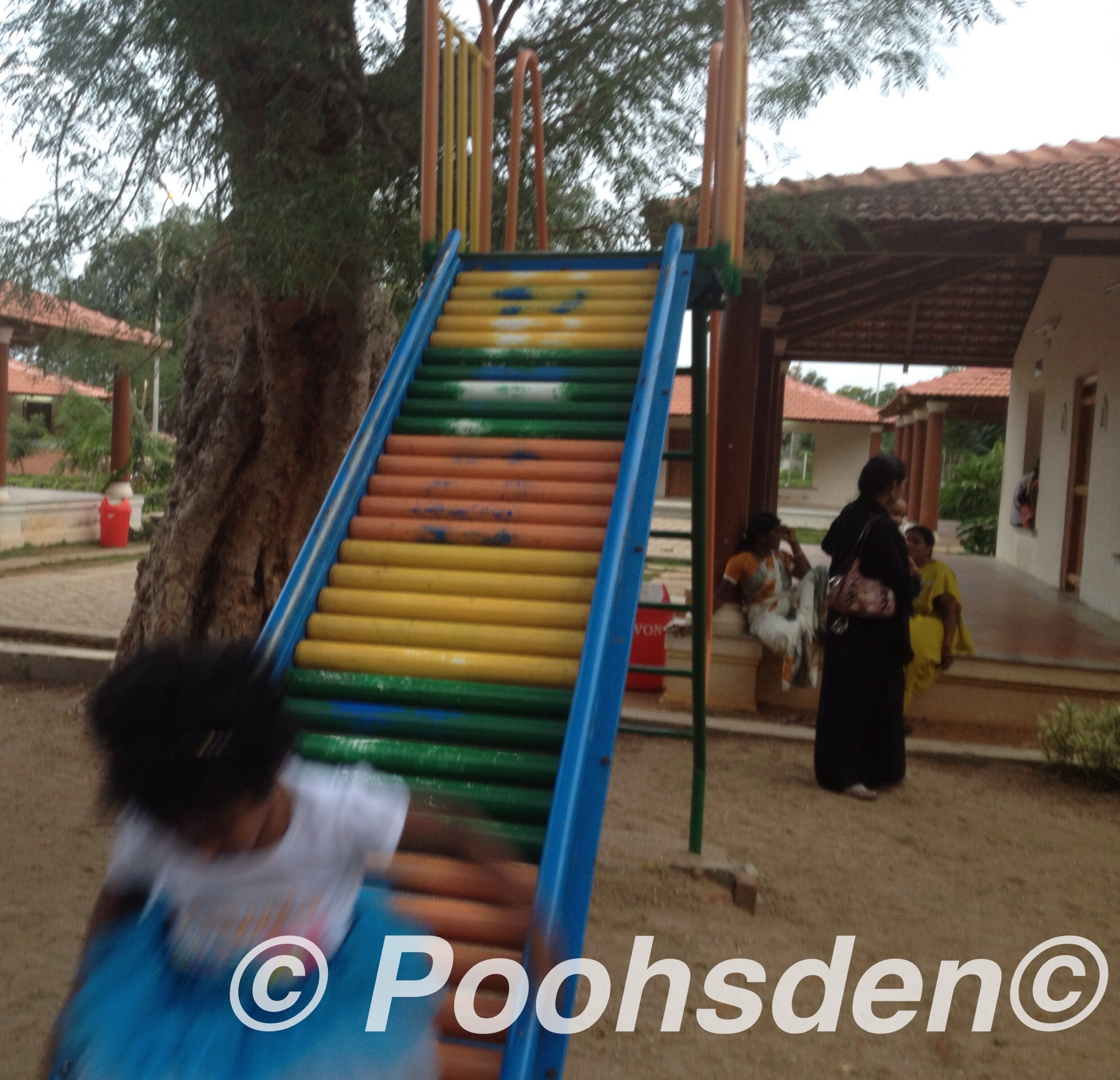 Kuttyma on the colored slide in Madurai, India